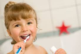 girl brushing teeth